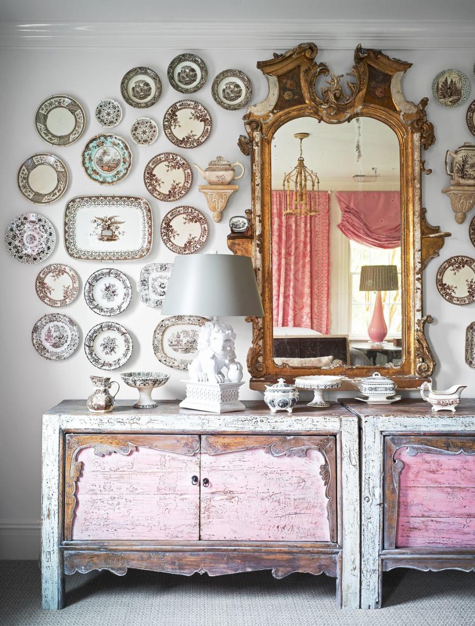 <p>If you have an extensive China collection, why not put it up for all to see? It's an unexpected twist to the classic gallery wall look, too, as you can see in this blush pink living room designed by <a href="https://janiemolster.com/" rel="nofollow noopener" target="_blank" data-ylk="slk:Janie Molster;elm:context_link;itc:0;sec:content-canvas" class="link ">Janie Molster</a>. Once you've mapped out the gallery wall, all you need are some picture hangers. <a href="https://www.housebeautiful.com/design-inspiration/a29652925/how-to-hang-plates-on-wall/" rel="nofollow noopener" target="_blank" data-ylk="slk:Get a tutorial here.;elm:context_link;itc:0;sec:content-canvas" class="link ">Get a tutorial here. </a></p>