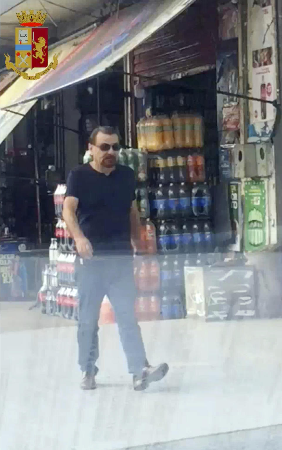In this frame grab taken by a video released by the Italian Police, Sunday, Jan. 13, 2019, Italian fugitive communist militant Cesare Battisti walks in Santa Cruz de la Sierra, Bolivia. Italy sent an aircraft to Bolivia on Sunday to pick up Battisti after he was captured there nearly three decades after he was convicted of murder, setting the stage for a climax to one of Italy’s longest-running sagas.(Italian Police Via AP)