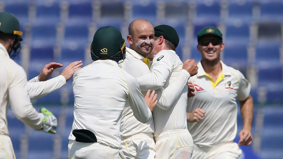 Nathan Lyon of Australia celebrates with teammates after dismissing Babar Azam of Pakistan. Pic: Getty