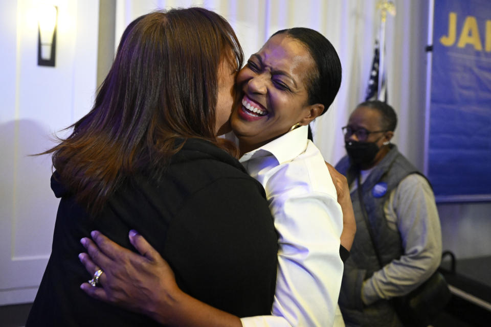 United States Rep. Jahana Hayes, D-Conn., front right, is embraced by a supporter at her election night event in Waterbury, Conn., Tuesday, Nov. 8, 2022. Hayes is running for reelection in Connecticut's fifth congressional district against Republican House candidate George Logan. (AP Photo/Jessica Hill)