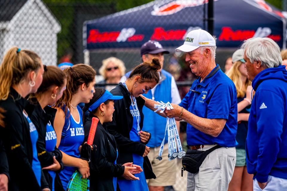 Wareham tennis coach Geoff Swett and Wareham Athletic Director Edward Rodriques give out the MIAA Division 4 State Finalist medals to the team.