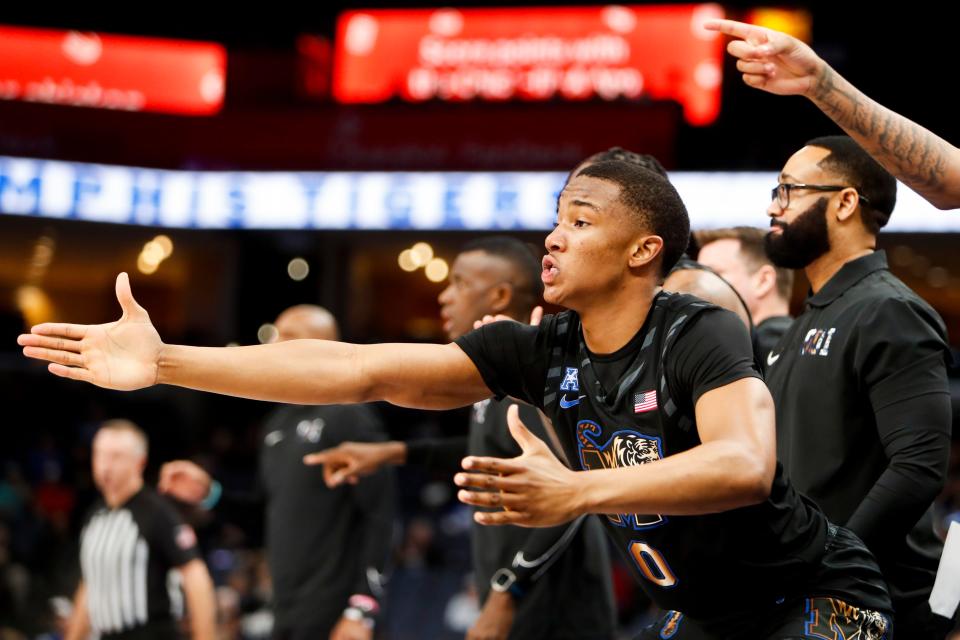 Memphis' Jonathan Pierre (0) cheers on his teammates during the game between the University of Charlotte and the University of Memphis at FedExForum in Memphis, Tenn., on Wednesday, February 21, 2024.