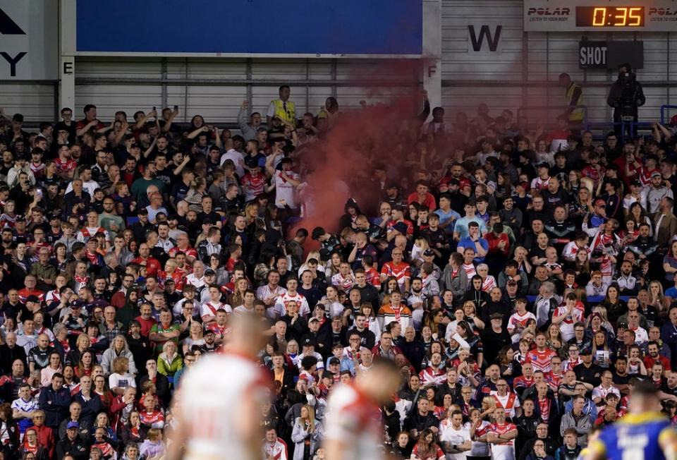 A flare is visible among the St Helens fans who packed the away end at The Halliwell Jones Stadium (PA Images/Zac Goodwin) (PA Wire)