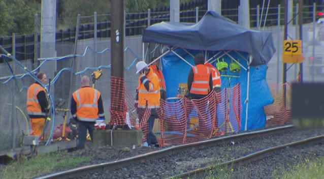 Metro crews try to repair damage after overnight fire at Richmond. Photo: 7News