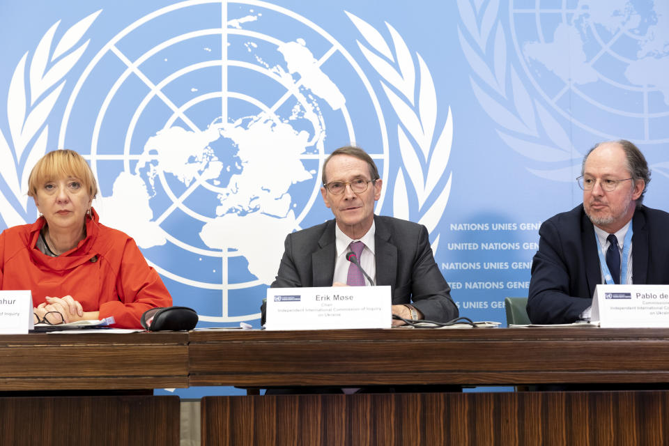 Erik Mose, center, Chair of the Commission of Inquiry on Ukraine, Jasminka Dzumhur, left, and Pablo de Greiff, right, Commissioners of Inquiry on Ukraine, talk to the media during a press conference following an update to the UN Human Rights Council, at the European headquarters of the United Nations in Geneva, Switzerland, Friday, Sept. 23, 2022. A team of experts commissioned by the U.N.’s top human rights body to look into rights violations in Ukraine said Friday its initial investigation turned up evidence of war crimes in the country following Russia’s invasion nearly seven months ago. (Salvatore Di Nolfi/Keystone via AP)