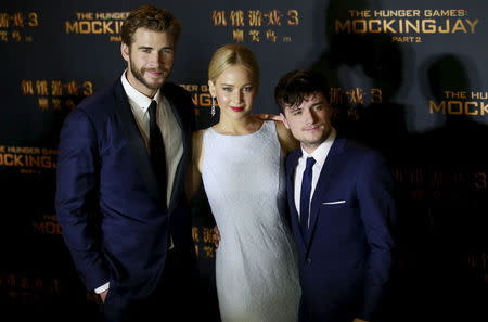 Cast members Liam Hemsworth, Jennifer Lawrence and Josh Hutcherson (L-R) pose at a red carpet event for the China premiere of "The Hunger Games: Mockingjay - Part 2" in Beijing, China, November 12, 2015. REUTERS/Kim Kyung-Hoon