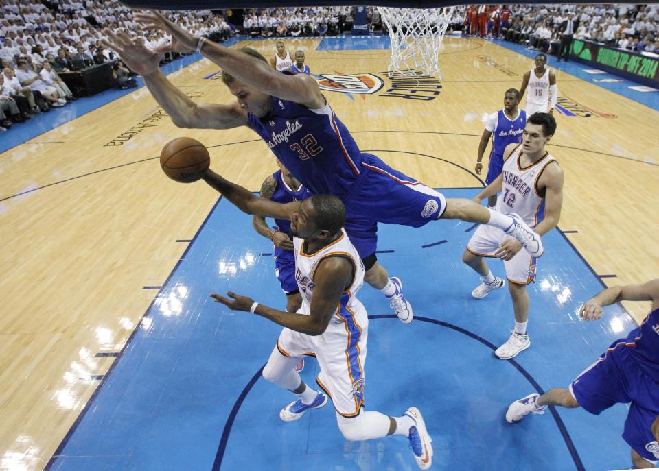 Oklahoma City Thunder forward Kevin Durant (35) is fouled by Los Angeles Clippers forward Blake Griffin (32) in the second quarter of Game 5 of the Western Conference semifinal NBA basketball playoff series, in Oklahoma City on Tuesday, May 13, 2014. (AP Photo)