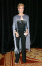 For a trip to Las Vegas, Celine Dion stunned in a black jumpsuit finished with a sparkling cape back in 2003 with a fresh blonde pixie crop to finish. [Photo: Getty