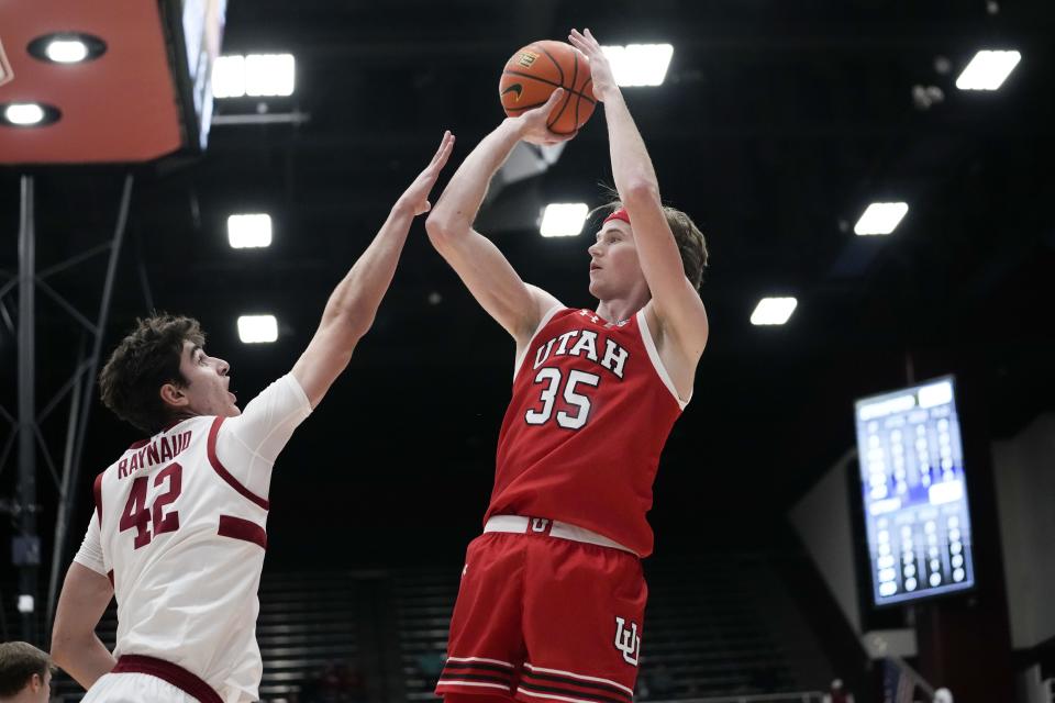 Utah center Branden Carlson (35) shoots over Stanford forward Maxime Raynaud (42) during the first half of an NCAA college basketball game, Sunday, Jan. 14, 2024, in Stanford, Calif. | Godofredo A. Vásquez, Associated Press