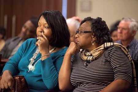 Stinney family relatives Mable Pratt (L) and her cousin Jannie Nelson, both of Columbia, South Carolina, listen during testimony in the case of George Stinney Jr., in Sumter, South Carolina, January 22, 2014. REUTERS/Randall Hill