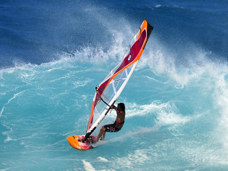 A windsurfer at Ho'okipia Beach Park in Paia, Maui, Hawaii.