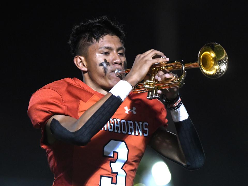 Lockney's Daniel Alvarado plays the trumpet during halftime of the District 3-2A Division II high school football game against Ralls on Friday at Mitchell Zimmerman Field in Lockney.