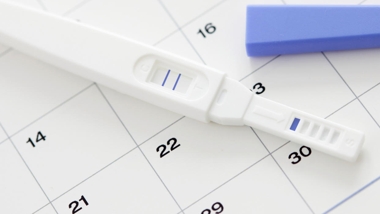  positive pregnancy test on a calendar chart 