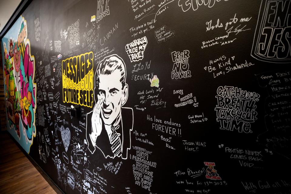 The headquarters of the Worth and Purpose ministry in Lakeland features a wall on which visitors are encouraged to write messages. Travis and Amber Settineri formed the nonprofit, which is largely devoted to helping homeless people.
