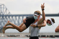 <p>Thomas Mackintosh holds up Sam Bosworth, both of Team New Zealand, after winning the gold medal during the Men's Eight Final A on day seven of the Tokyo 2020 Olympic Games at Sea Forest Waterway on July 30, 2021 in Tokyo, Japan. (Photo by Naomi Baker/Getty Images)</p> 