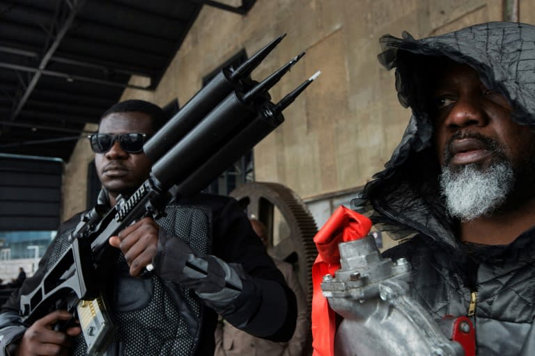 Nigerian artist Wilfred Ukpong (R) during the public opening of Africa's largest museum of contemporary art