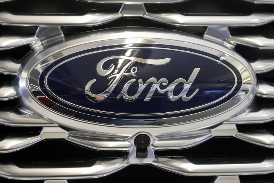 FILE - This Feb. 14, 2019 file photo shows the Ford logo on the front grill of a 2019 Ford Explorer on display at the 2019 Pittsburgh International Auto Show in Pittsburgh. On his first day in Ford’s top job, new CEO Jim Farley is replacing the company’s chief financial officer and announcing other structural and management changes. The company says in a statement Thursday, Oct. 1, 2020, that Chief Financial Officer Tim Stone is leaving Oct. 15 to be chief operating officer at a small artificial intelligence company. (AP Photo/Gene J. Puskar, File)