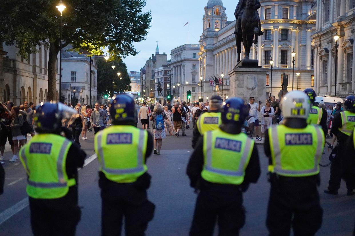 Police officers with people attending the 'Enough is Enough' protest in Westminster, London, following the fatal stabbing of three children at a Taylor Swift-themed holiday club on Monday in Southport. Picture date: Wednesday July 31, 2024.