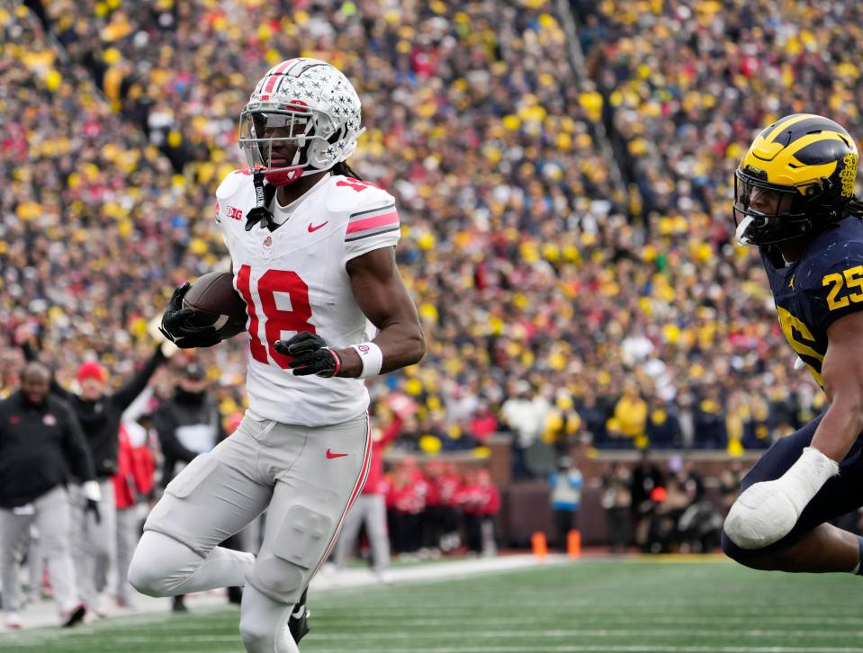 Nov. 25, 2023; Ann Arbor, Mi., USA;
Ohio State Buckeyes wide receiver Marvin Harrison Jr. (18) scores a touchdown during the second half of Saturday's NCAA Division I football game against the University of Michigan.