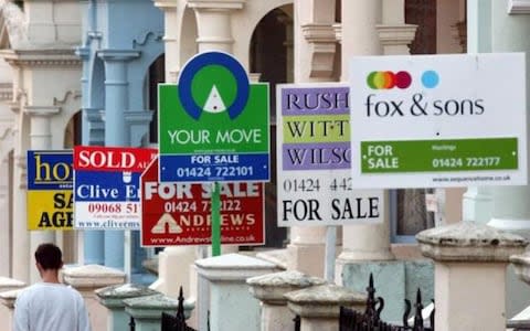 Photo showing estate agents signs outside properties in Hastings, Kent - Credit: Toby Melville/PA