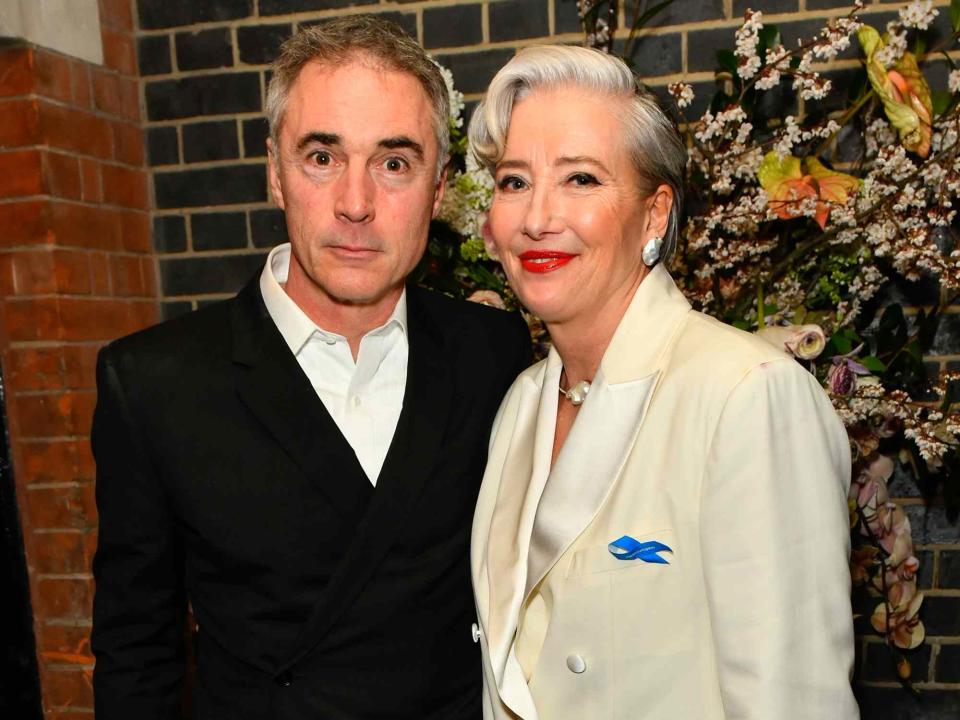 <p>Dave Benett/Getty</p> Greg Wise and Dame Emma Thompson attend Netflix