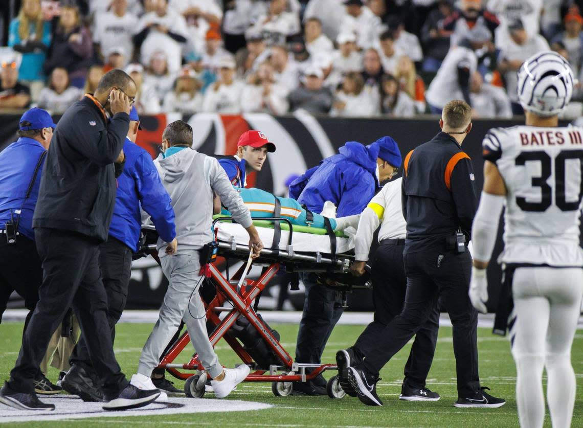 Miami Dolphins quarterback Tua Tagovailoa (1) is being transported by medical team after being sacked by Cincinnati Bengals defensive tackle Josh Tupou (68) during the second quarter of an NFL football game at Paycor Stadium on Thursday, September 29, 2022 in Cincinnati, Ohio.
