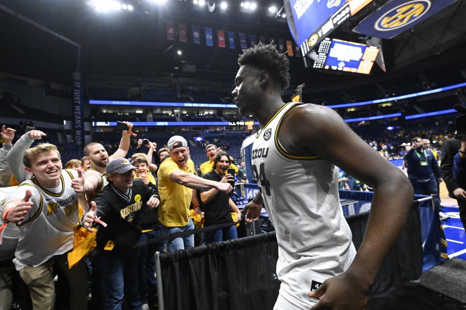 Missouri guard Kobe Brown celebrates with fans after an NCAA college basketball game against Tennessee in the quarterfinals of the Southeastern Conference Tournament, Friday, March 10, 2023, in Nashville, Tenn. Missouri won 79-71. (AP Photo/John Amis)