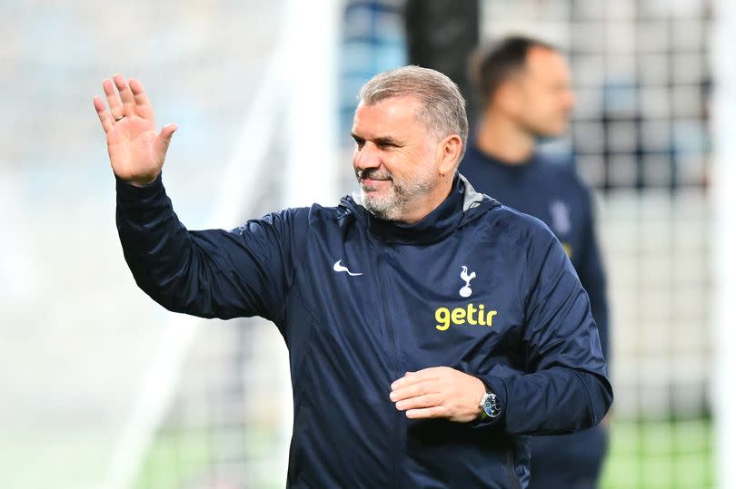 Ange Postecoglou, Manager of Tottenham Hotspur, acknowledges the crowd