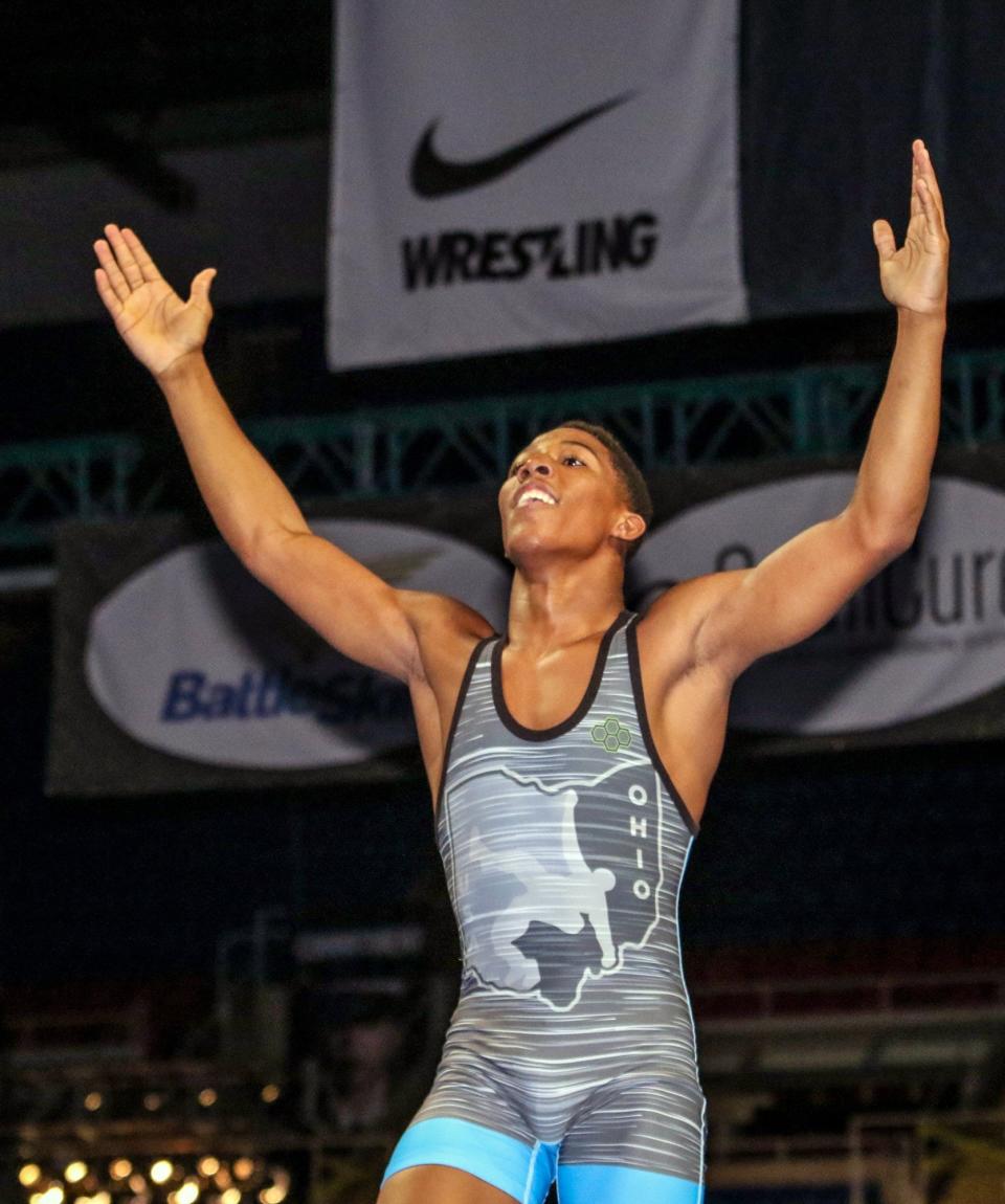 Perry's David Carr (left) was named the tournament MVP after winning the 160-pound Junior National Freestyle title in Fargo, N.D. en route to his national title.