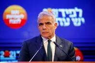 FILE PHOTO: Yesh Atid party leader Yair Lapid delivers a speech following the announcement of exit polls in Israel's general election at his party headquarters in Tel Aviv