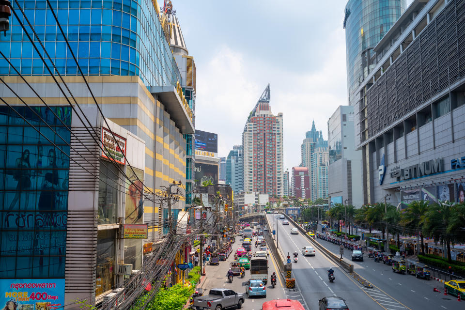 Busy traffic in Pratunam shopping district in Bangkok Thailand during day time