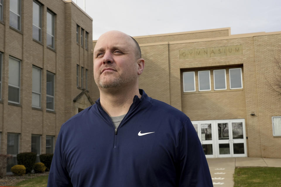 East Palestine High School athletic director Dwayne Pavkovich poses for a portrait, Monday, March 6, 2023, in East Palestine, Ohio. Pakovich is busy scheduling spring sports following the Feb. 3 Norfolk Southern freight train derailment. (AP Photo/Matt Freed)