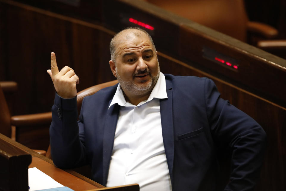 Leader of the United Arab List Mansour Abbas attends a Knesset session in Jerusalem Sunday, June 13, 2021. Bennett is expected later Sunday to be sworn in as the country's new prime minister, ending Prime Minister Benjamin Netanyahu's 12-year rule. (AP Photo/Ariel Schalit)