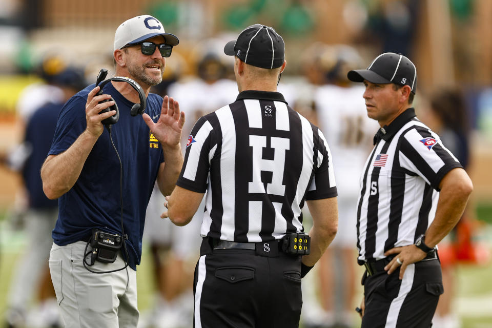 California head coach Justin Wilcox, left, argues a call during the second half of an NCAA college football game against North Texas, Saturday, Sept. 2, 2023, in Denton, Texas. (AP Photo/Brandon Wade)