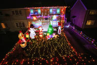 A mum has gone all out to cheer up her kids and neighbours by putting up her CHRISTMAS decorations three months early - including 3,000 outdoor lights. Caroline Gabe, 46, has been shielding with her children since March - and said putting up her tree and decorations in September was a much-needed boost. She has spent the year buying outdoor lights and installations - from as far away as America - and put them all up last week, on a whim. Almost all of them are outside - including 3,000 fairy lights, sparkling snow, an 8ft inflatable snowman, as well as Santa and his reindeer.