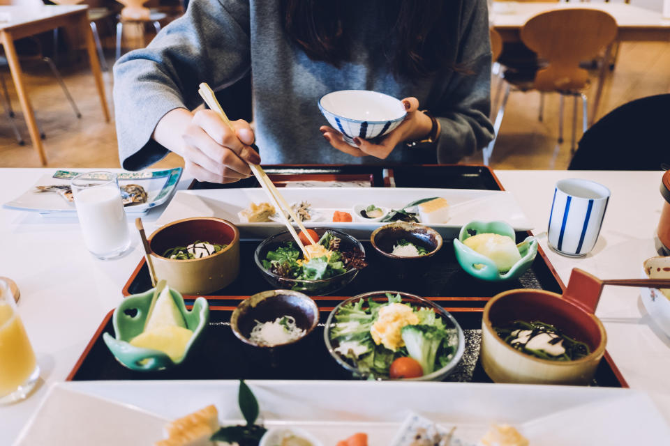 A woman eating a meal in Japan.