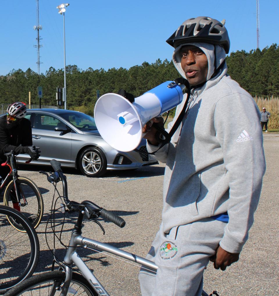 Don "DB Donamatrix" Brooks speaks to bicyclists before the start of the first family bike ride during Donamatrix Day at Petersburg Sports Complex on April 2, 2022.