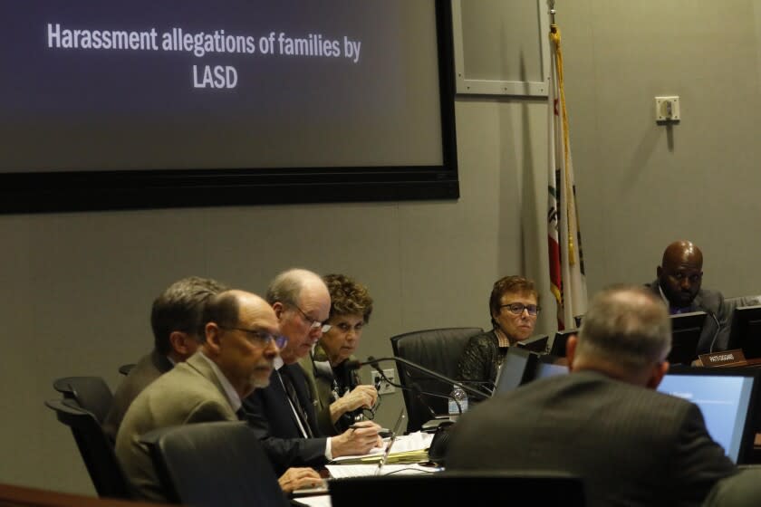 LOS ANGELES, CA - NOVEMBER 19, 2019 - The L.A. County Civilian Oversight Commission prepare to hear testimonials from family members who lost loved ones in sheriff involved shootings and to vote on a motion to direct the Office of Inspector General and the Sheriff's Department to initiate formal investigations into harassment of families affected by fatal use of force at the Metro Boardroom in Los Angeles on November 19, 2019. (Genaro Molina / Los Angeles Times)