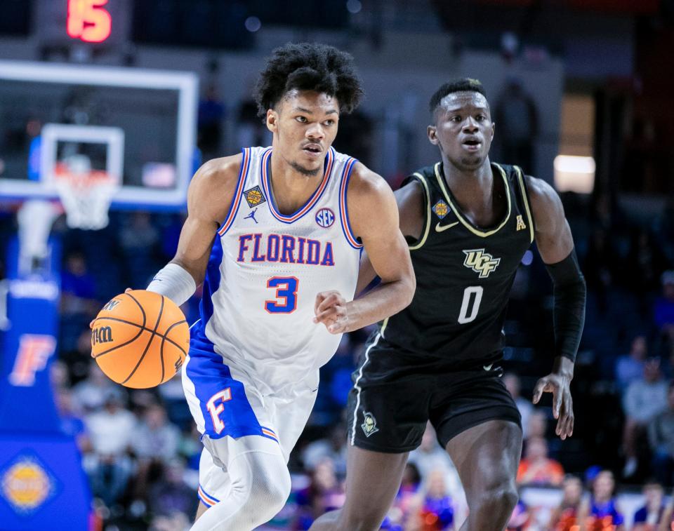 Florida Gators forward Alex Fudge (3) brings the ball down court during the NIT in March against UCF.
