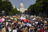 Demonstrators walk along Pennsylvania Avenue as they protest the death of George Floyd, Wednesday, June 3, 2020, in Washington. Floyd died after being restrained by Minneapolis police officers. (AP Photo/Evan Vucci)