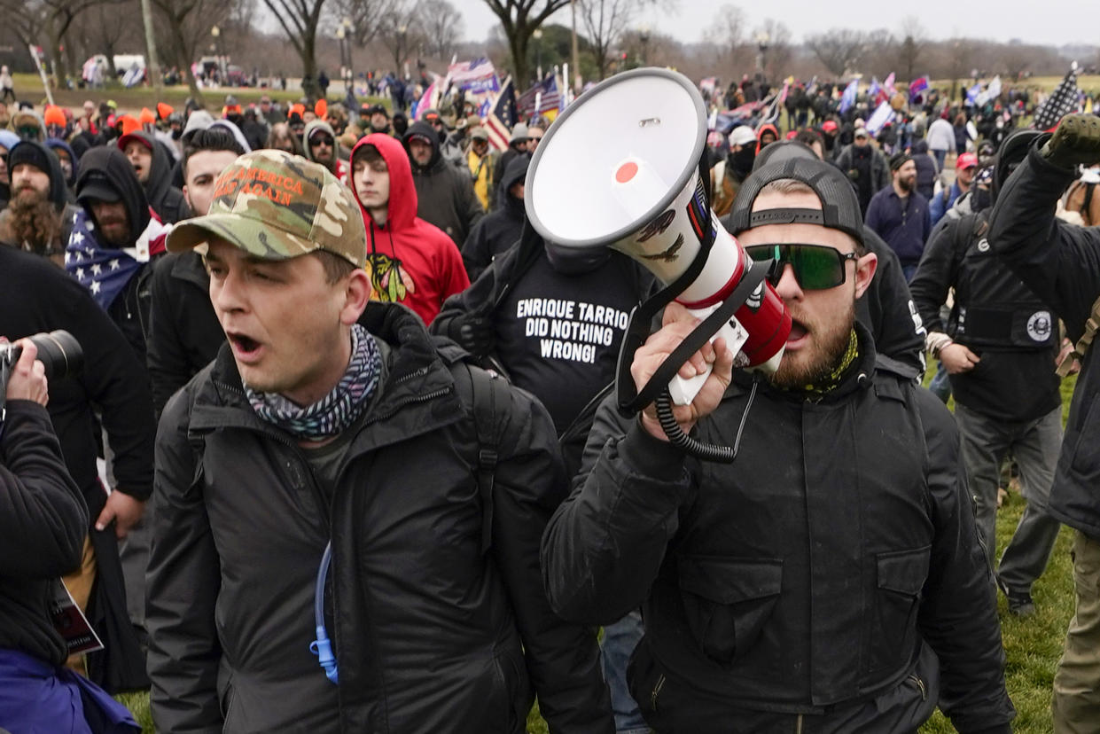 Proud Boys members Zachary Rehl and Ethan Nordean walk toward the U.S. Capitol in support of President Donald Trump on Jan. 6, 2021. 