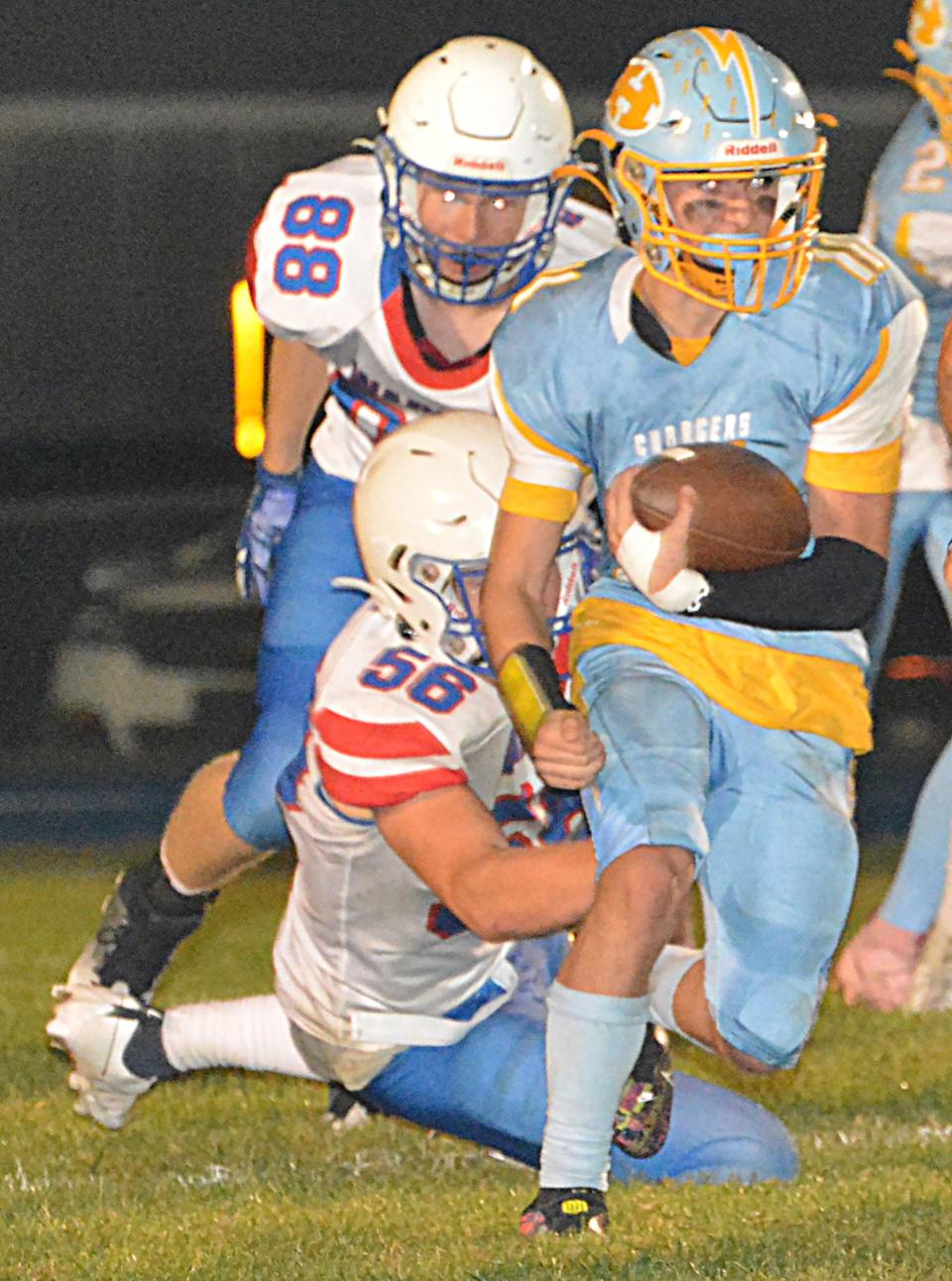 Hamlin's Turner Stevenson is brought down by Warner's Zachary Evans during their high school football game on Friday, Sept. 29, 2023 in Hayti. No. 1 Class 9A Warner beat No. 2 Class 9AA Hamlin 22-13.