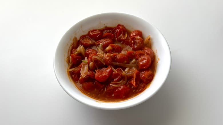 a bowl filled with tomato sauce 