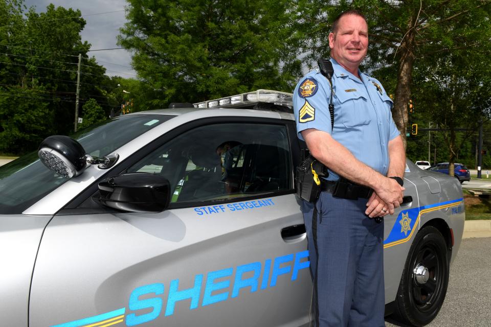 Deputy Tim Johnson poses for portrait at the intersection of Washington Road and Blanchard Road on Tuesday, April 30, 2024.