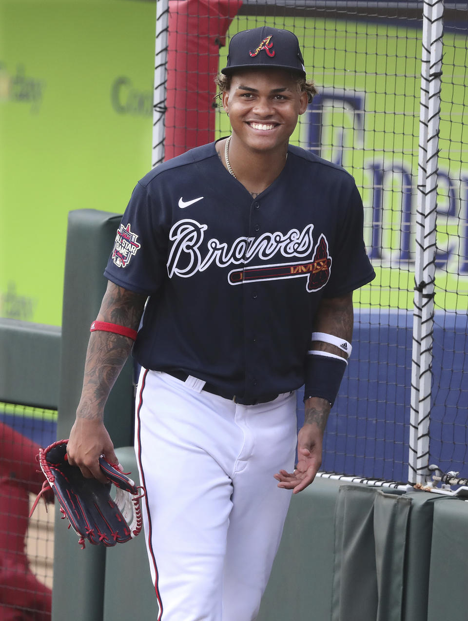 Atlanta Braves outfielder Cristian Pache is all smiles arriving for spring training baseball batting practice in North Port, Fla., Wednesday, Feb. 24, 2021. (Curtis Compton/Atlanta Journal-Constitution via AP)