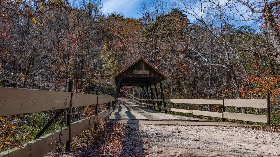 In Mentone, Alabama, the historic Old Union Crossing Covered Bridge was originally built in 1863. This version was rebuilt over an existing bridge in 1980. - Jacqueline Nix/iStock Editorial/Getty Images