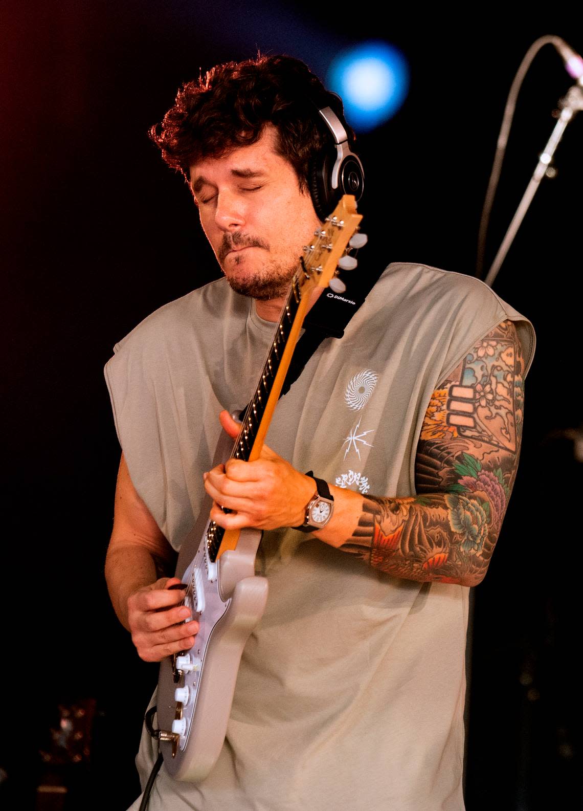 John Mayer, complete with headphones, performs as Dead & Company bring their final tour to Raleigh, N.C.’s Coastal Credit Union Music Park at Walnut Creek, Thursday night, June 1, 2023.