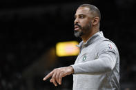Boston Celtics coach Ime Udoka watches during the first half of the team's NBA basketball game against the San Antonio Spurs, Friday, Nov. 26, 2021, in San Antonio. (AP Photo/Darren Abate)
