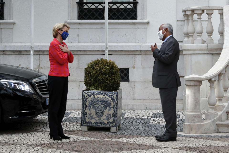 European Commission President Ursula von der Leyen is welcomed by Portuguese Prime Minister Antonio Costa at the Sao Bento palace in Lisbon, Monday, Sept. 28, 2020. (AP Photo/Armando Franca)