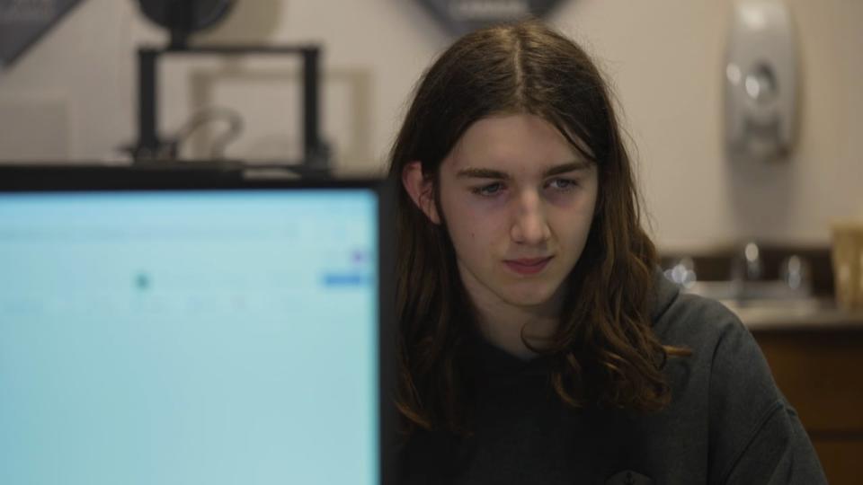 Grade 8 student Caleb Jeffries works away on his computer as he prepares for a national competition that will put his cybersecurity skills to the test.